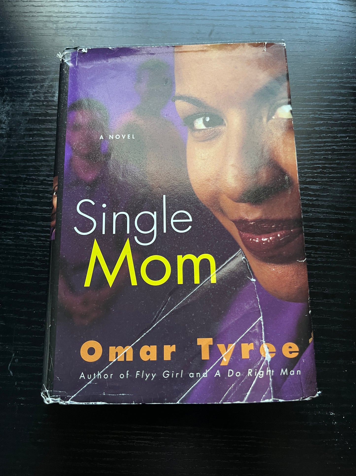 SINGLE MOM: A Novel by Omar Tyree